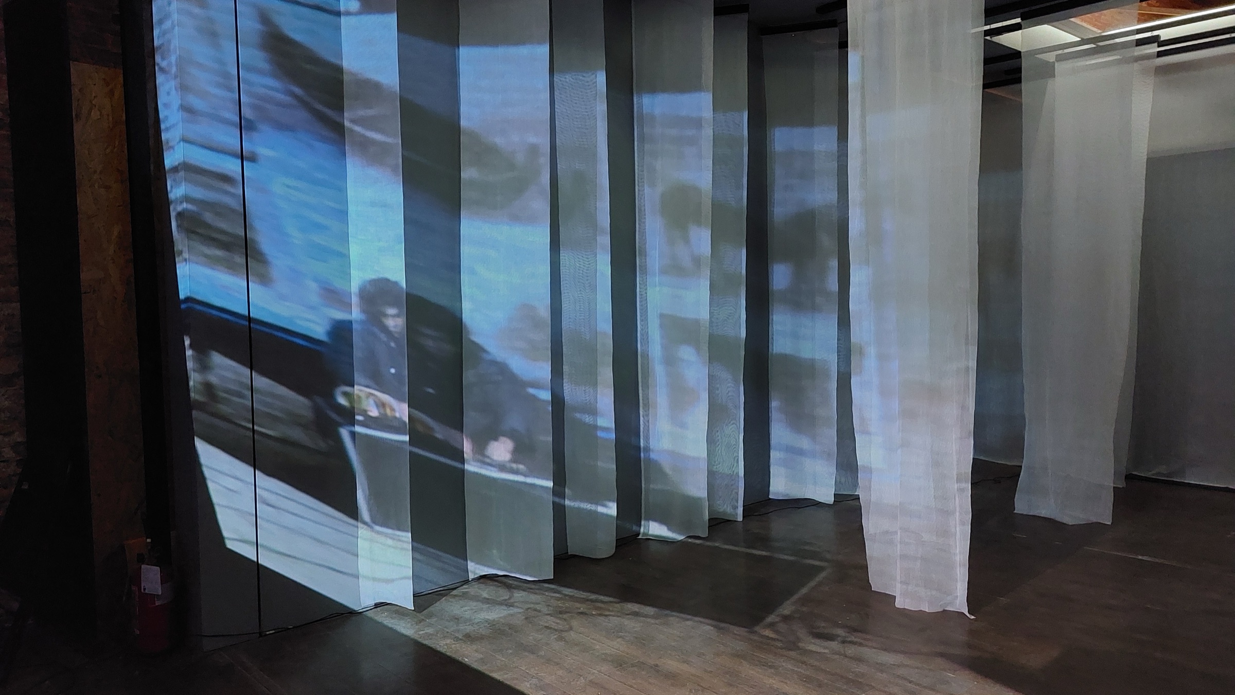 Projected video and hanging fabric in an Autotropo installation